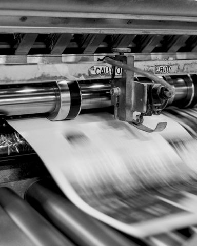 A photo of a newspaper press in action.