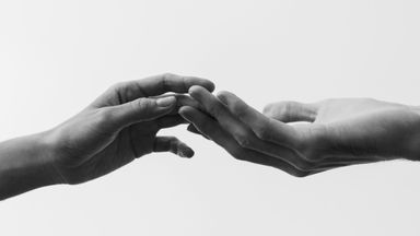 two hands connecting