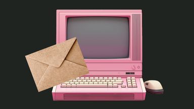 Old-school pink computer with old-school paper envelope.