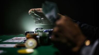 A person placing bets.